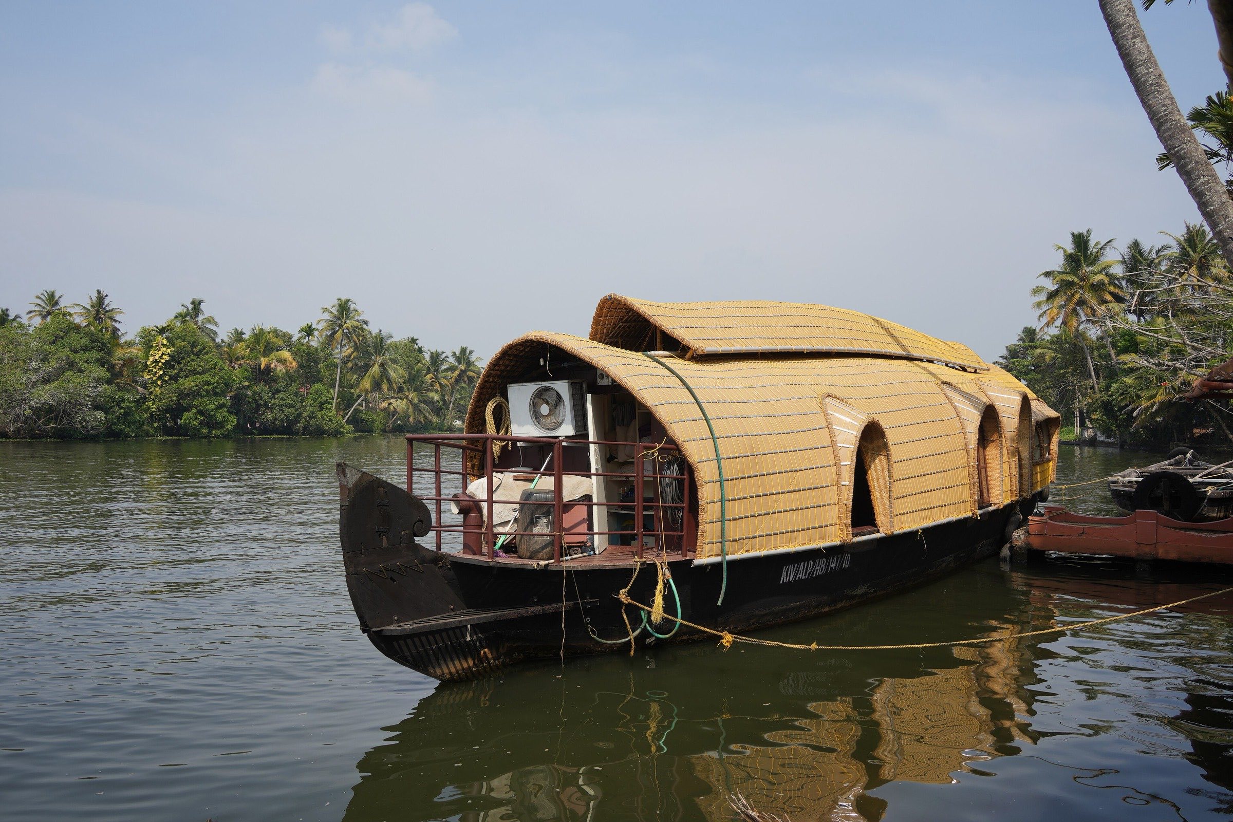 Traditional kettuvallam houseboat moored on the backwaters