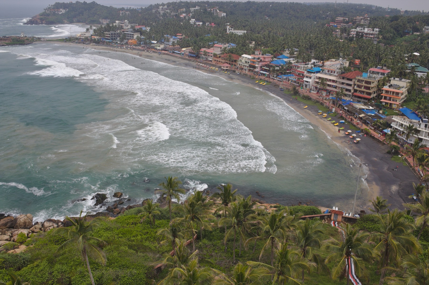 Crescent beach and headland at Kovalam